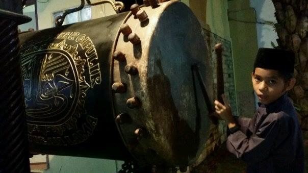 playing drum inside The Adhan - Malay Drum Tradition